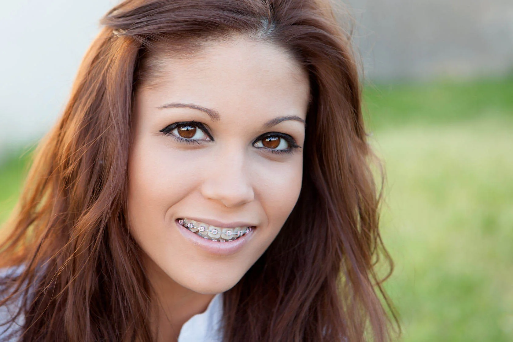 Happy family sharing beautiful smiles after orthodontic treatment