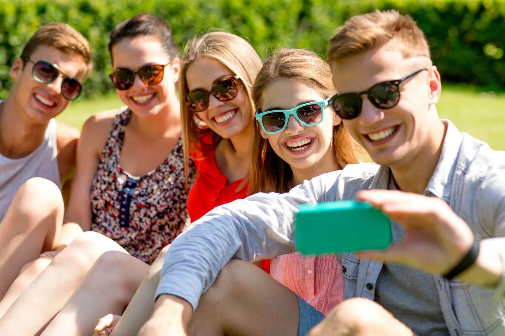 Happy orthodontic patients smiling at Suffolk Braces